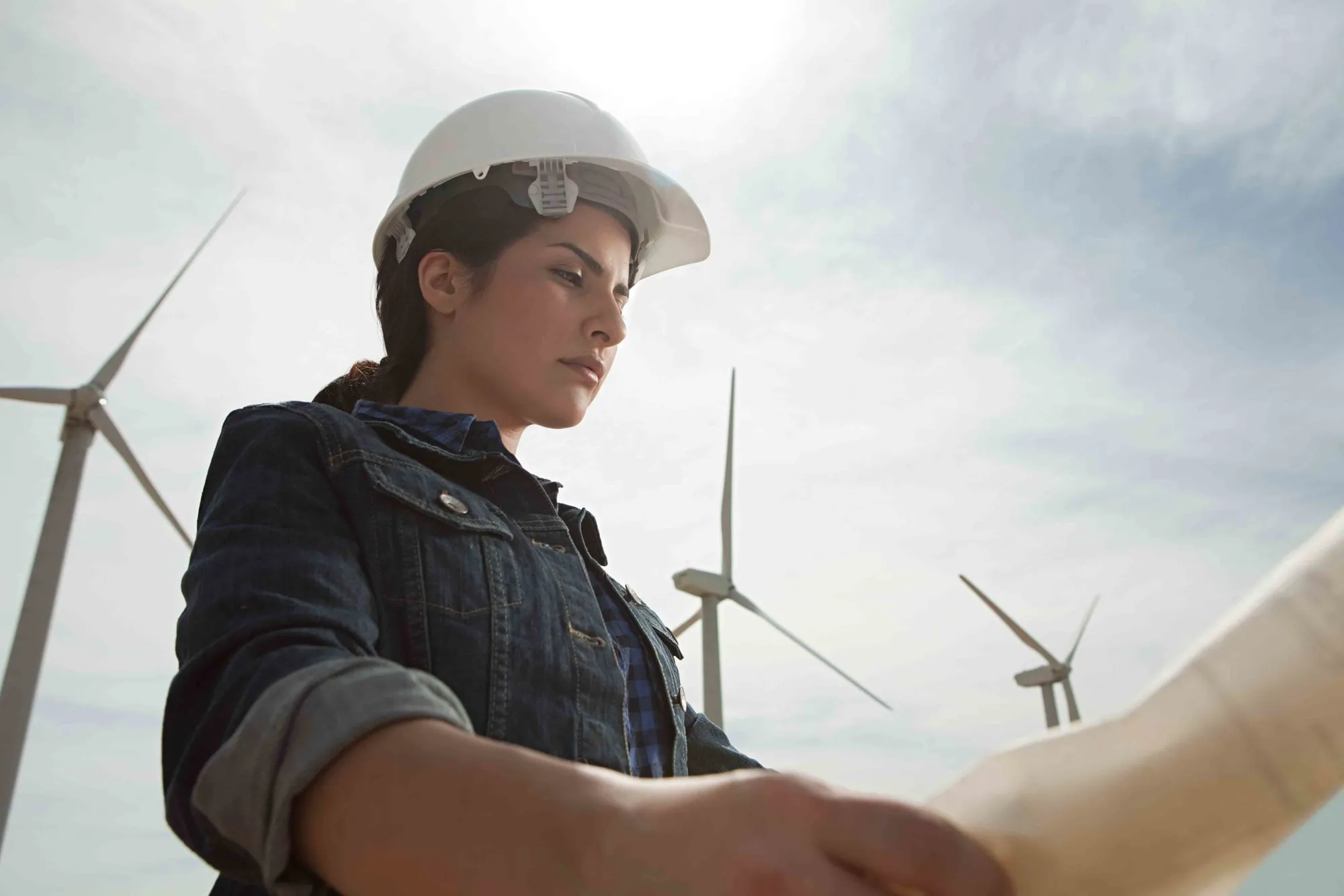 An engineer working with documentation on-site.